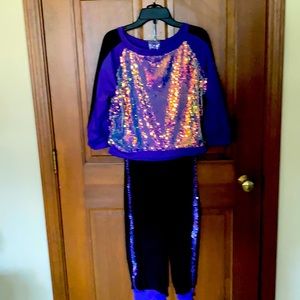 Purple and black 2-piece sequined dance outfit.